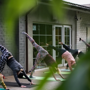 Lady's doing yoga outside